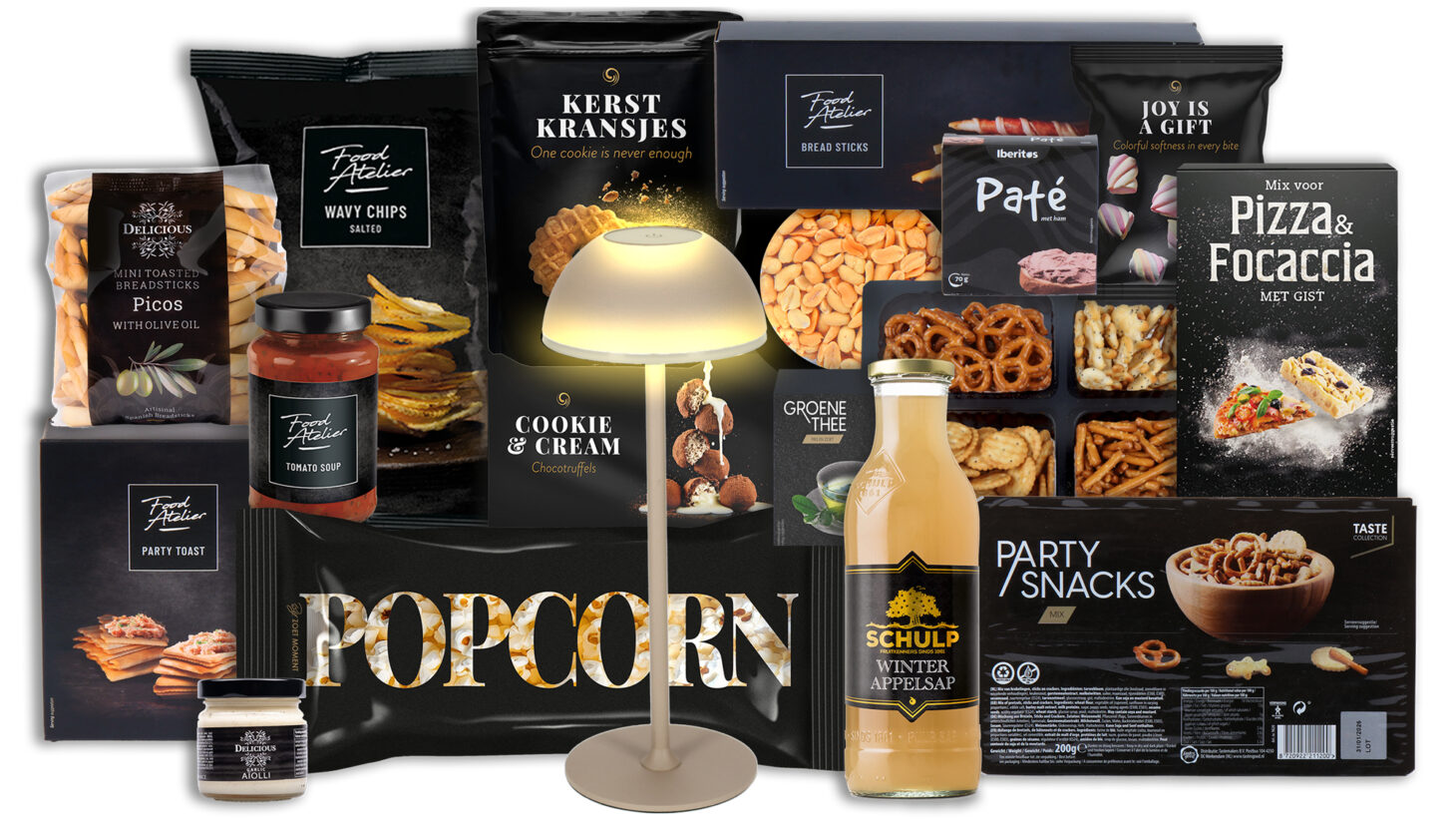 Kerstpakket Stralende Feestdagen met snacks, Schulp appelsap, pizza mix, koekjes en sfeervolle lamp.